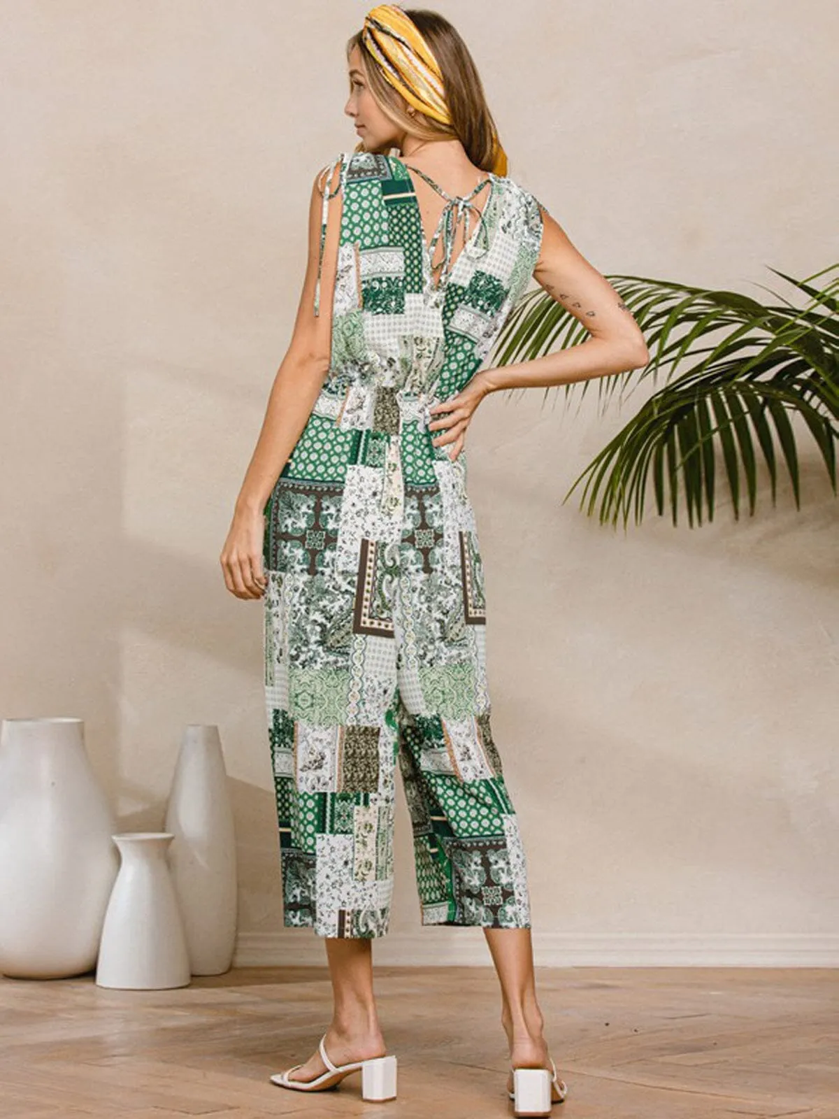 WOMEN'S SLEEVELESS V-NECK SURPLICE POCKETS MULTI PRINT JUMPSUIT
